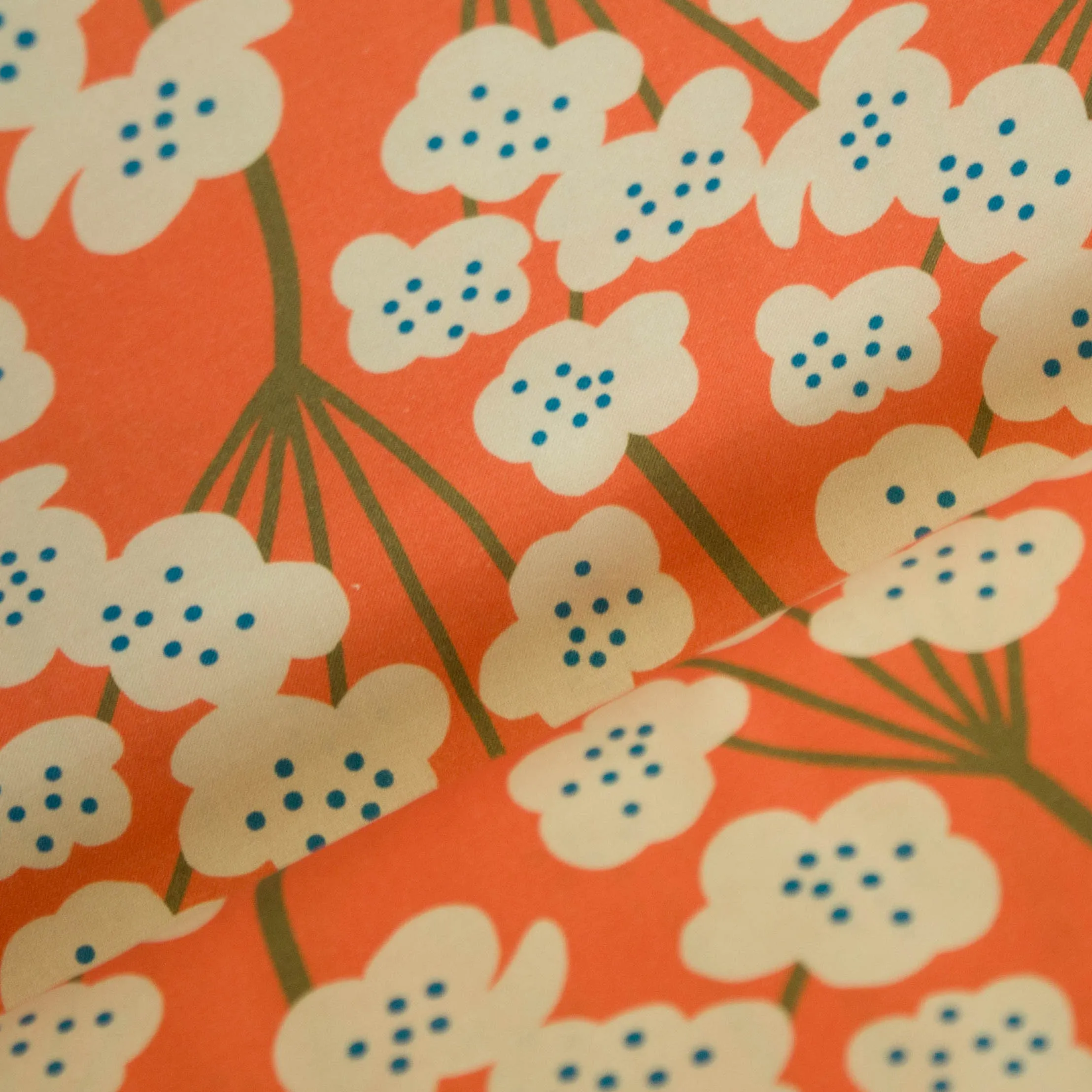 Katoen oranje met witte bloemen